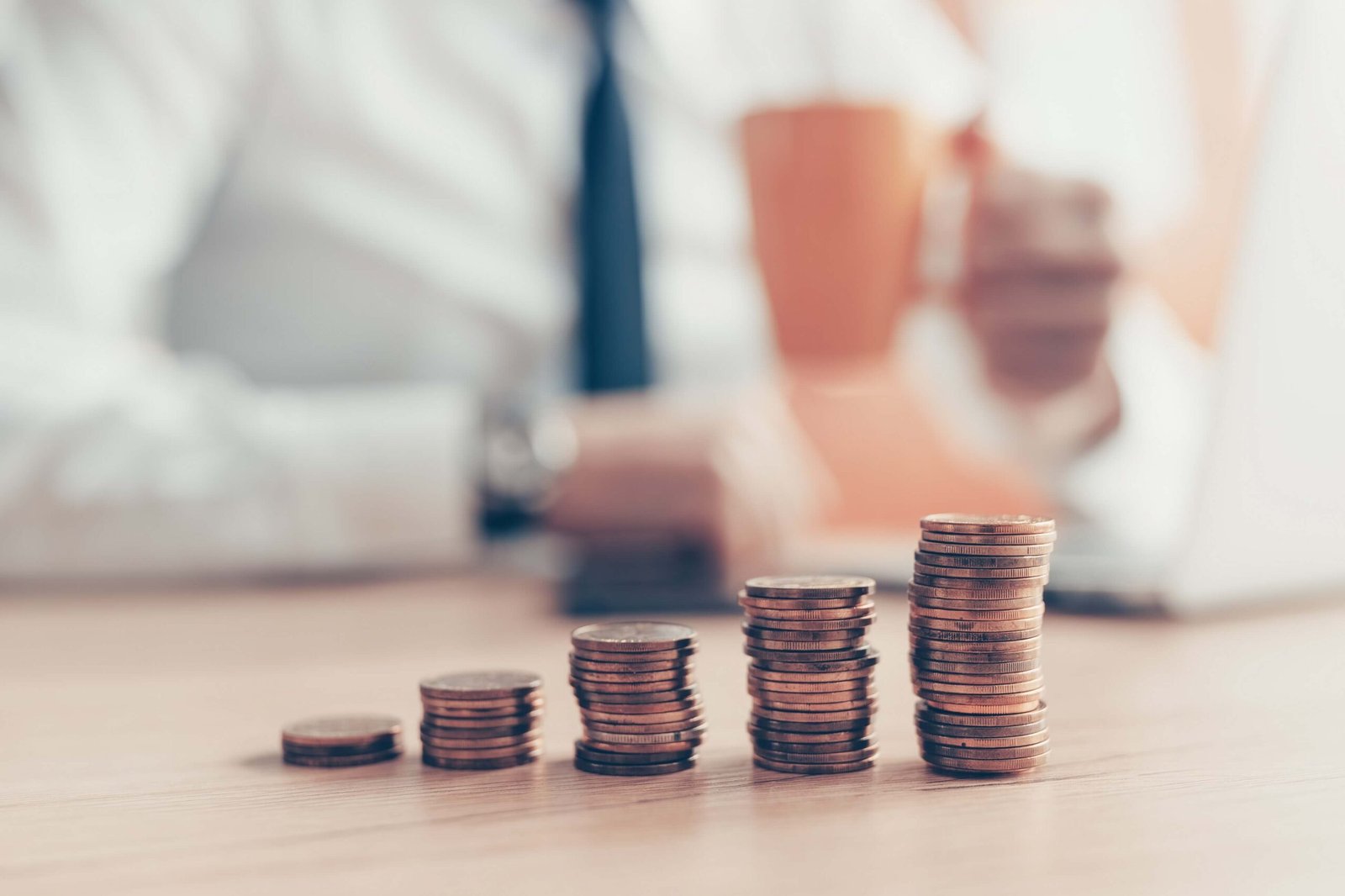 Understanding the role of insurance in financial planning satisfied businessman drinking coffee with coin st p7kqwku